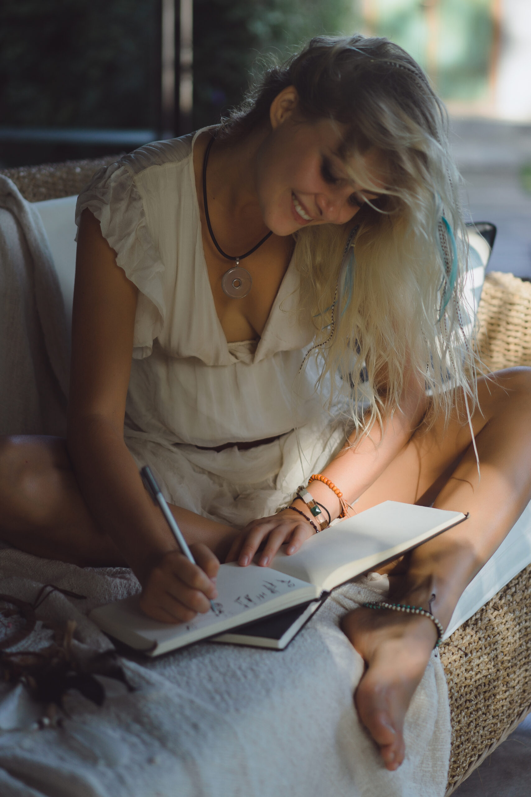 happy girl spends time at home in a cozy interior, writes and dr